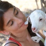 beautiful girl with cute baby goat